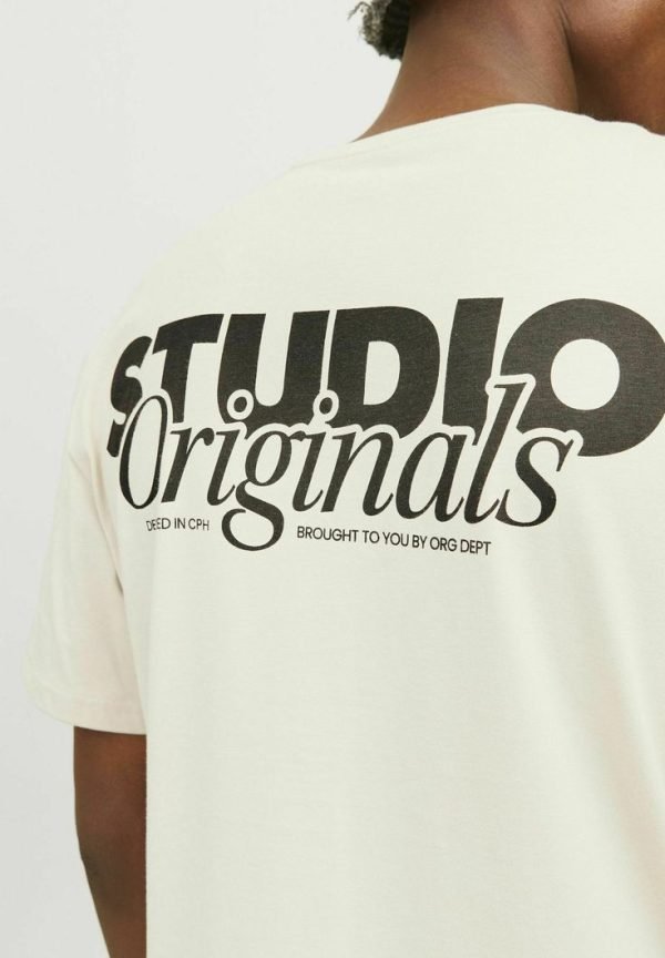 Cream oversized T-shirt with a black typographic back print